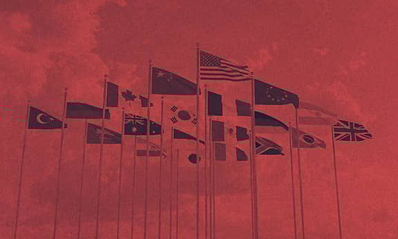 A group of flag poles together.